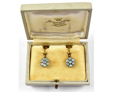 A pair of vintage opal cluster earrings, the drops set with seven tiny opals suspended on 9ct gold screw backs, approx. 2.2g.