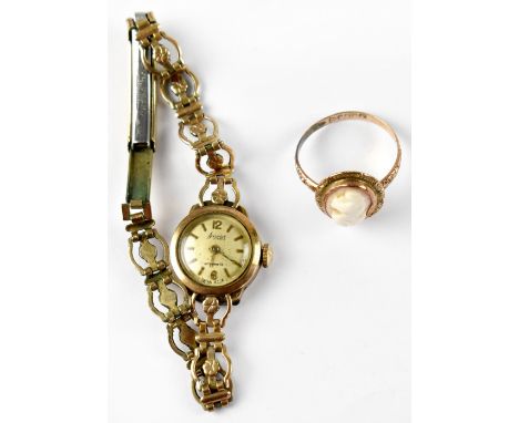 A late 19th century 9ct gold cameo ring, size P and a ladies' 9ct gold Accurist wristwatch, the silvered dial set with baton 