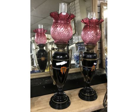PAIR OF VICTORIAN CERAMIC OIL LAMPS WITH ORIGINAL HINKS NO.2 BURNERS &amp; MATCHING PAIR OF CRANBERRY GLASS SHADES