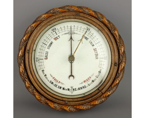 20th century Marine aneroid Barometer, ceramic dial in circular ropetwist carved oak case, D23cm    Condition Report   Click 