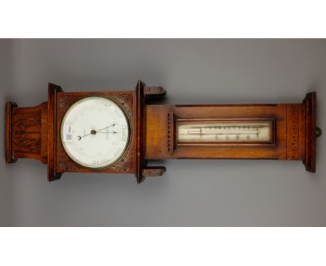 Edwardian oak cased aneroid Barometer with Thermometer by Oetzmann & Co, with carved detail, H73cm   Condition Report   Click