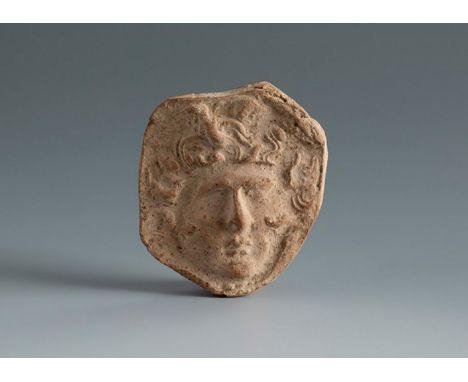 Medusa's head. Smyrna, 4th-3rd century BC.Terracotta.Provenance: Smyrna, 1895-1905. Collection Paul Gaudin (Paris 1858-1921 V