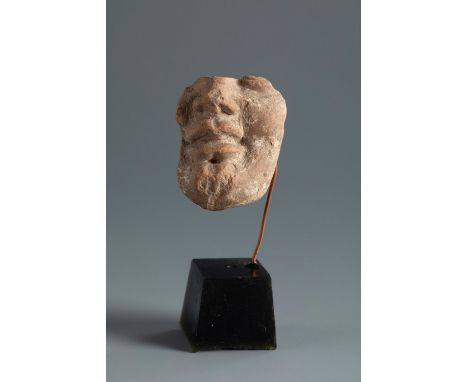 Male head. Smyrna, 4th-3rd century BC.Terracotta.Provenance: Smyrna, 1895-1905. Collection Paul Gaudin (Paris 1858-1921 Versa