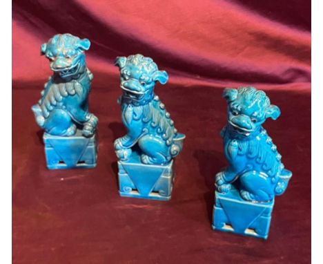 Set of three early 20th century turquoise ceramic Foo Dog statues with glaze finish. Traditional guardian lion artistry. Each