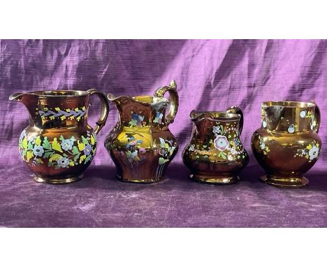 Four similar vintage copper glazed, hand painted jugs, largest 13cm (h)  / All lots are located at The Barn, Hampstead Farm, 