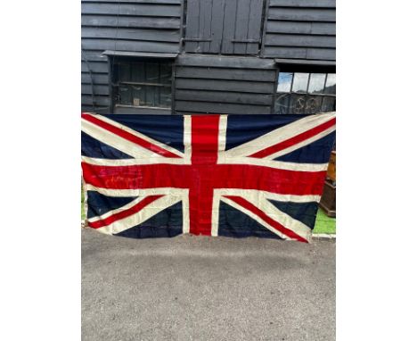 A large vintage British Union Jack flag, minor flaws and a few holes, 140cm (h) x 269cm (w)  / All lots are located at The Ba