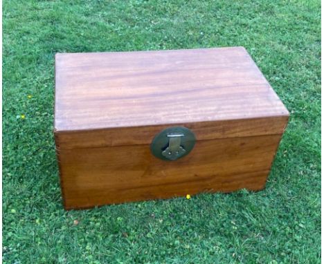 A 19th century campherwood campaign trunk with brass clasp and plate / All lots are located at The Barn, Hampstead Farm, Nr H