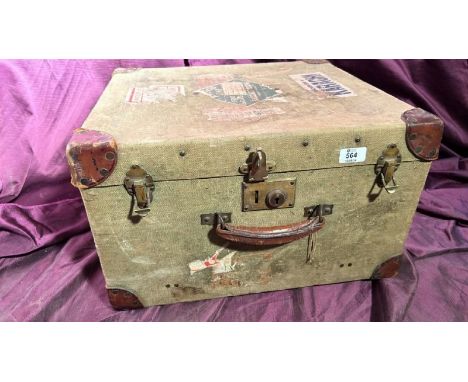 An early 20th century canvas bound and riveted luggage trunk, 31cm (h) x 50.5cm (w) x 45.5cm (d)  / All lots are located at T