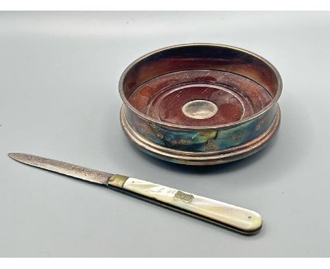 A hallmarked silver dish  by Carrs with a silver and mother of pearl pen knife.  / All lots are located at The Barn, Hampstea