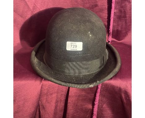 Early 20th century vintage black bowler hat with ribbon trim and satin lining.    / All lots are located at The Barn, Hampste
