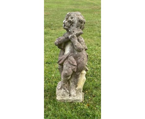 A 20th century composition stone cherub statue blowing a pipe / All lots are located at The Barn, Hampstead Farm, Nr Henley o