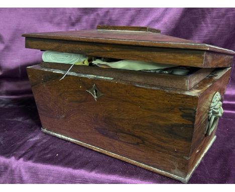 A vintage mahogany tea caddy, with brass lion handles and contents. Measures 22 x 36 x 18cm  / All lots are located at The Ba