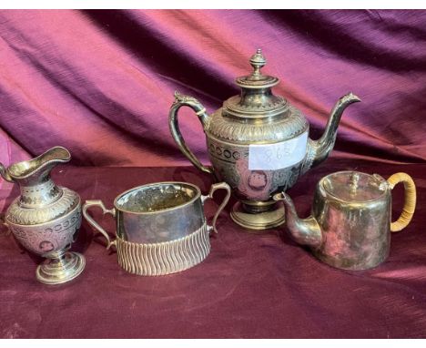 Set of four antique EPNS silver tea service pieces, including intricately engraved teapot, sugar bowl, creamer, and covered s