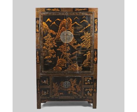 the large cupboard doors decorated with a mountain landscape enclosing a shelved interior with hanging rail, above further cu
