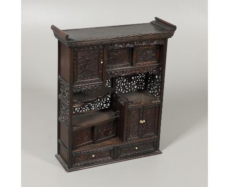 the altar top above an arrangement of cupboards, drawers and sliding compartments all decorated with birds among foliage, wit