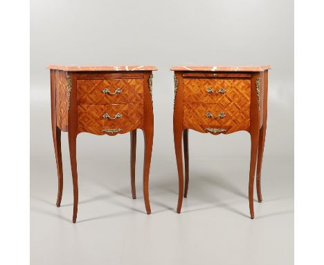 in the Louis XV style, the serpentine marble tops above brushing slide and two drawers, height 74cm (2) *see Bonhams 'The Sav