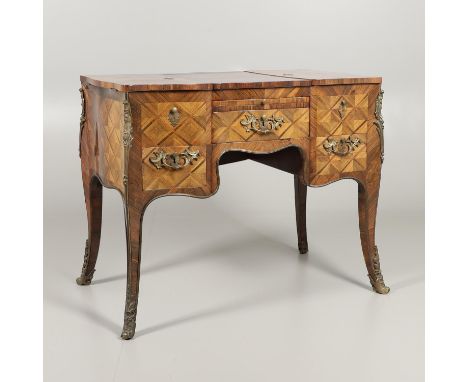 19th century, the crossbanded top with central hinged mirror flanked by two compartments over three drawers and pull out writ
