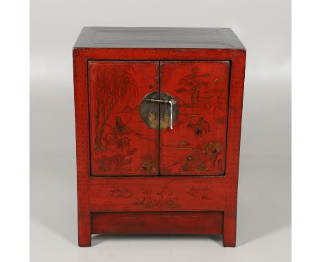 the cupboard doors decorated with figures and animals within a landscape, enclosing a shelved interior, height 84cm, width 65