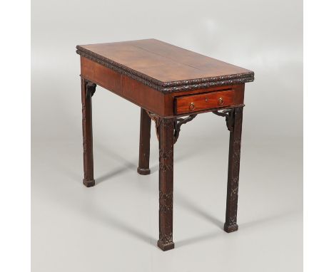 19th century, the fold over top lined with green baize and carved flower detail to edges, the ends each with a drawer on blin