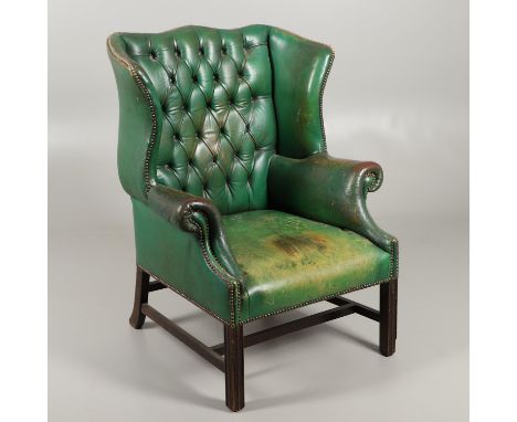 button backed and brass studded with scrolling arms on tapering square section legs, height 112cm, width 86cm, depth 79cm. *C