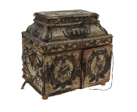 having hinged doors to the front with embossed silk to the inside, opening to reveal seven silk-lined drawers, including secr