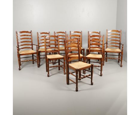 comprising two carvers and eight dining chairs, with ladder backs and rush seats, carver height 110cm (10). *Condition: Gener
