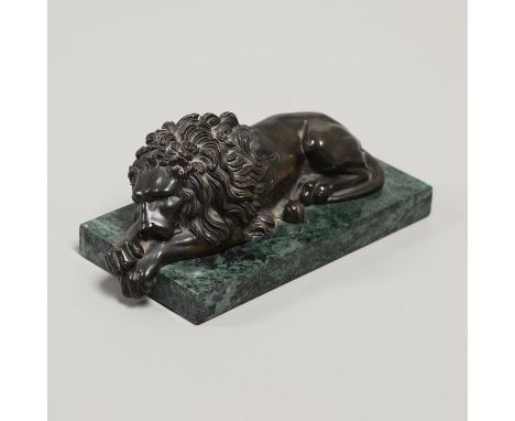 a small bronze study of a recumbent lion on a marble base, length 22.5cm. *Condition: No remarks.