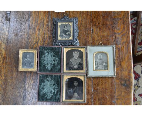 A companion pair of 19th century daguerreotypes, possibly American, of a man and wife, ornate gilt corner, leather case, 9cm 