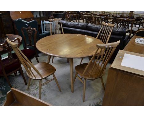 An Ercol dropleaf table and four spindle back dining chairs (5)