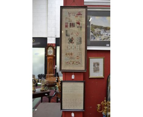 A 19th century woolwork sampler, worked in colours with a key, flowers, geometric motifs and the 'Flag that Braved 1000 Years
