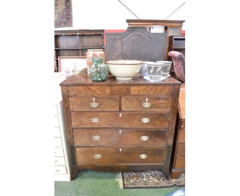 A 19th century mahogany chest of drawers, two short hidden drawers, two cockbeaded drawers over three graduated long, ivory e