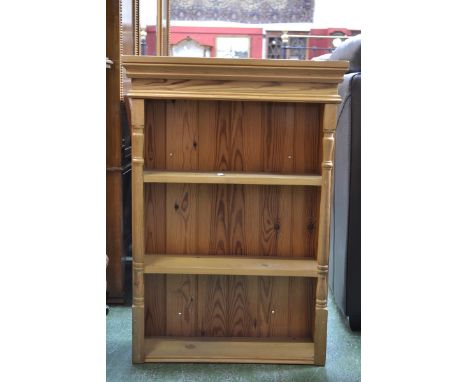 A modern pine three tier shelf unit