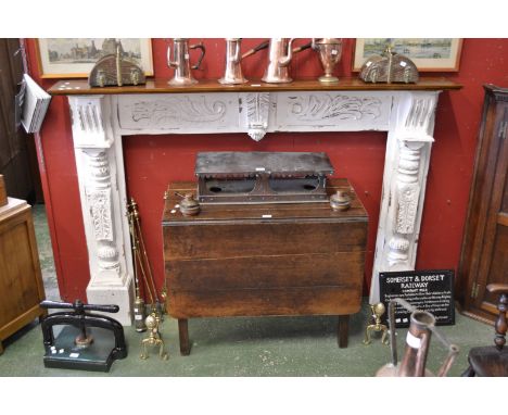 A reproduction mahogany fire surround.
