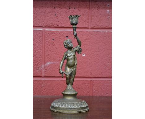 A 19th century bronze lamp base, cast as a scantily clad putto raising aloft an acanthus sconce, domed base with acanthus and