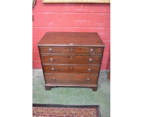 A George III oak chest of two short and three long graduated drawers, bracket feet