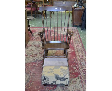 A 1970's beechwood rocking chair; two upholstered footstools.