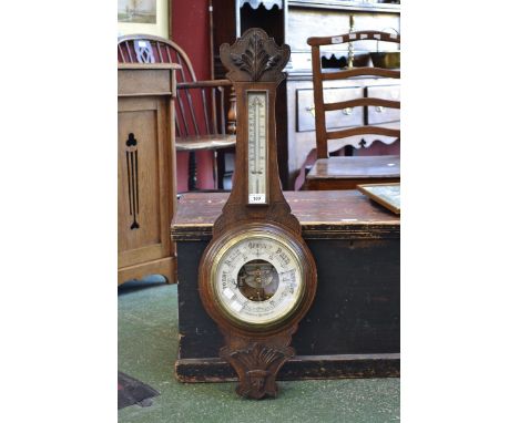 A carved oak aneroid banjo barometer, Martin Wilkinson, Mansfield.