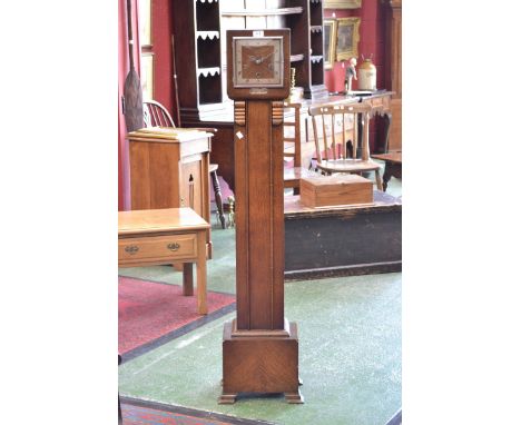 An Art Deco three keyhole grandmother clock.