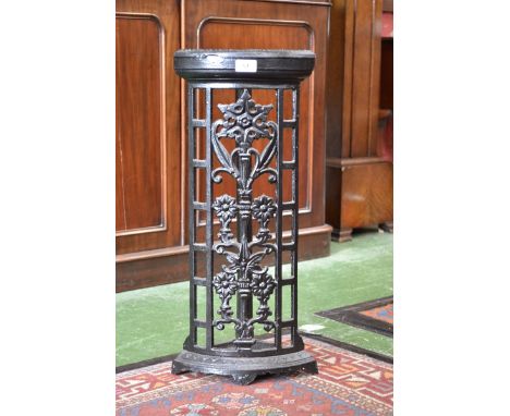 A cast iron bow fronted corner stick stand, beaded top, floral lattice work to front, casting mark "Biclam *409"