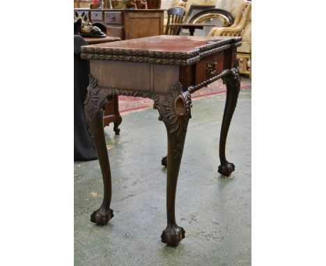 A Chippendale Revival mahogany card table, bipartite hinged top enclosing a baize lined playing surface, ball and claw feet, 