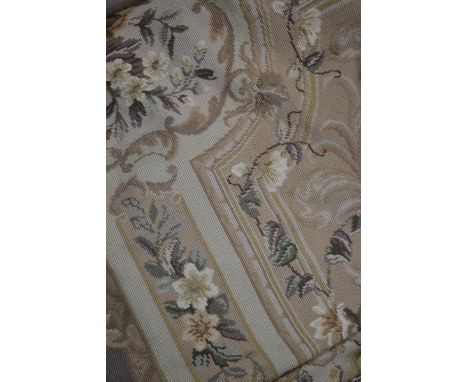 Textiles - a hand stitched tapestry floor covering, in the French classical taste, applied with flowers and scrolling foliage