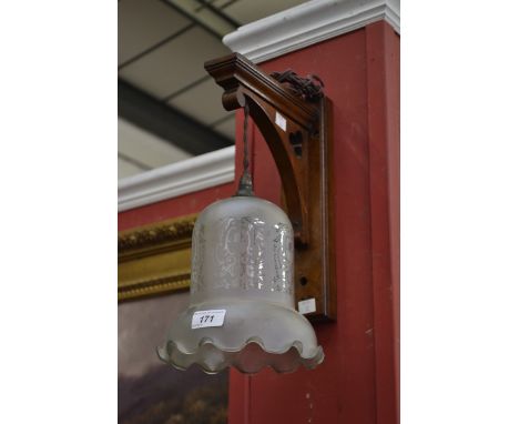 Gothic revival oak wall lamp with etched glass shade