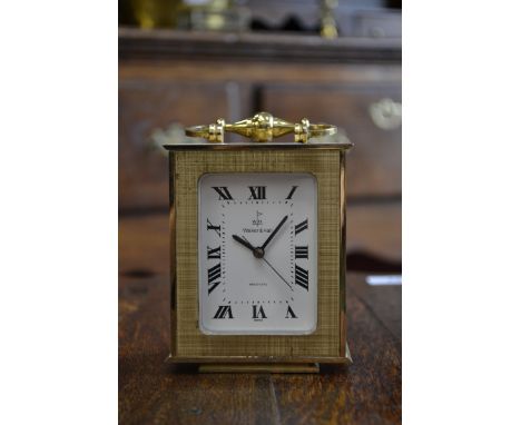 A laquered brass carriage clock, Walker & Hall.