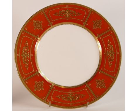 Mintons, heavily gilt burnt orange cabinet plate. Raised gilt border in Regency style patterns and gilt rim to base. Diameter