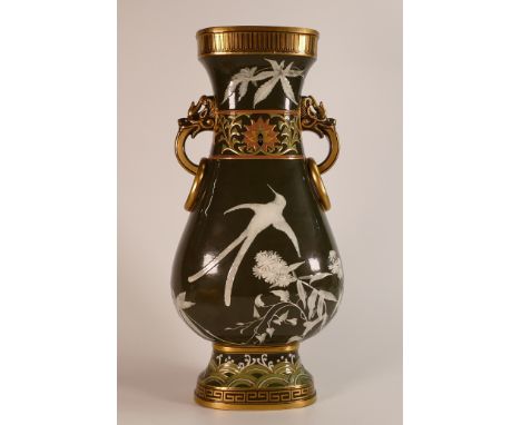 Mintons Pate sur Pate two handled vase, the dragon head and ringed handles flanking a band of enamelled floral decoration, th