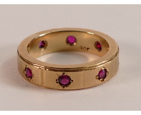 9ct Gold eternity ring, set with red stones all around, size L, 6.2g.