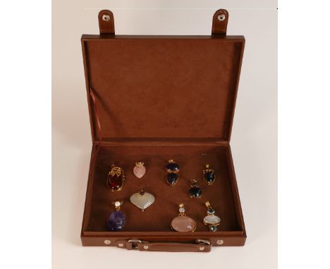 A good collection of quality Silver gilt pendants, set with various agate stones and one set with amber. (10)