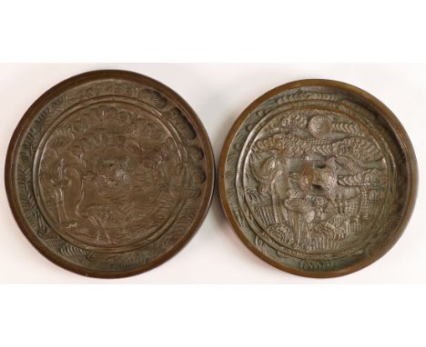A Chinese bronze roundel mirror dish, possibly Kangxi (1662-1722), cast with tortoise, crane and prunus blossom, d.10.5cm tog
