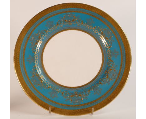 Mintons, heavily gilt blue cabinet plate. Raised gilt border. Diameter: 27cm