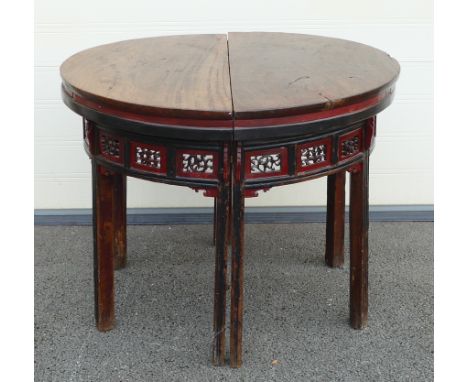 Two 19th century Chinese Half-Moon Console tables. Carved foliate panelled aprons. Height: 88.5cm (2)